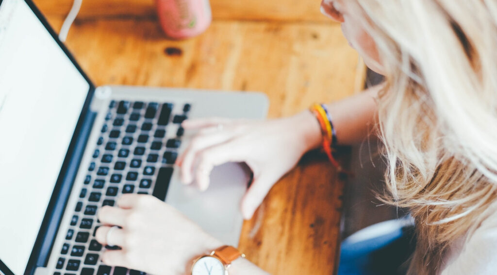 A picture of a person using a laptop computer